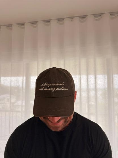 Helping Animals & Causing Problems Brown Dad Hat