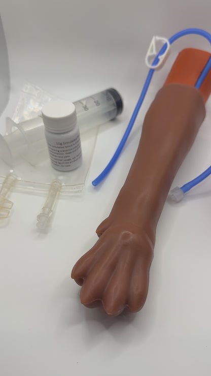 IV Canine Leg Training Kit for vet nurses vet techs trainees students vets with a realistic dog leg training arm, blood fluid bag, syringe, bandages, and small medical 'IV Canine Leg Training Kit' and 'VET NURSE SCHOOL'.